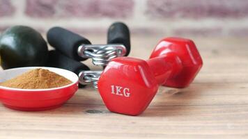 Dumbbells, a red kettlebell and a bowl of spices video