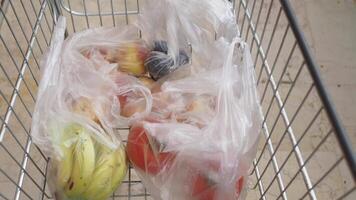 An Abundant Selection of Fresh Produce in Your Grocery Cart Diverse Fruits and Healthy Vegetables video