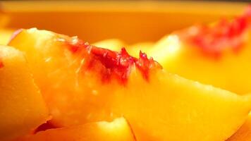 Fresh and Juicy Peach Slices Placed on a Bright and Vibrant Yellow Background Surface video