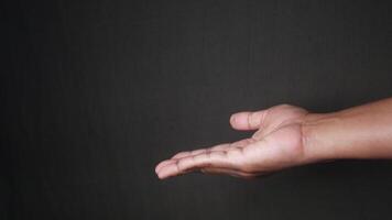 An Open Hand Presented Against a Dark Background for Various Creative Concepts and Ideas video