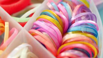 A Colorful and Vibrant Assortment of Elastic Bands Gathered Together in a Storage Container video