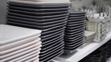An Array of Stacked Plates and Bowls Artfully Arranged in a Modern Kitchen Display Setting video