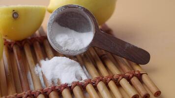 Baking soda and whole lemon on table video