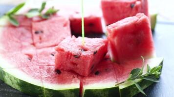 pieces of ripe red watermelon, close-up, on a board video