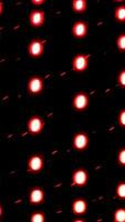 Vertical bending rows of small lights rotating on a dark background. Design. Spinning glowing light bulbs. video