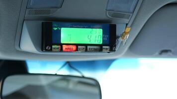 A car dashboard with a digital clock on it video