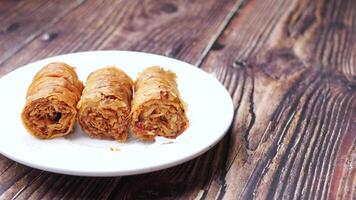 A plate with three rolls on it video
