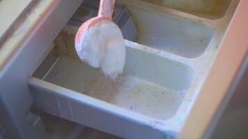 A spoon is in a container with a lot of food video