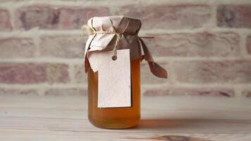 A jar of honey with a label on it video