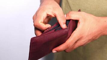 A person is holding a wallet with a card in it video