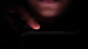 A person holding a cell phone in the dark video