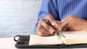 Man writing in notebook video