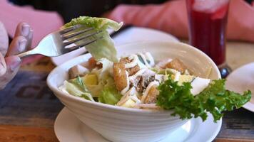 A person eating a salad with a fork video