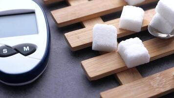 Sugar cubes and a digital thermometer on a wooden tray video