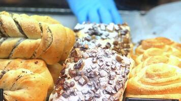 A display of pastries in a bakery video