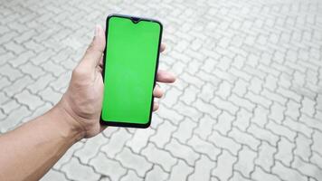 Green screen on smartphone in hand video