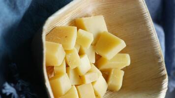 A bowl of cubed cheese sitting on a table video