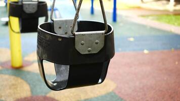 A swing is shown in a playground video