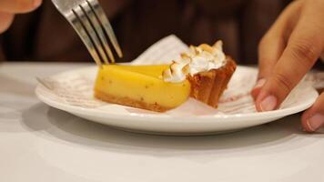 A person eating a piece of pie with a fork video