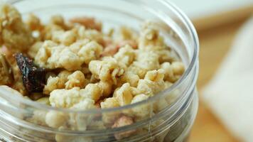 A jar filled with cereal and nuts on a table video