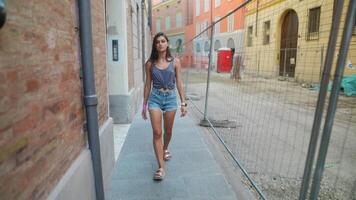 A woman is peacefully walking along a beautiful nature path surrounded by stunning scenery video