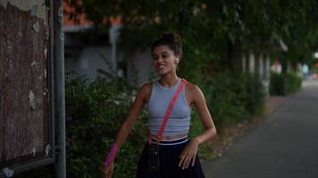 Taking a casual evening stroll while engaged in an enjoyable phone conversation with a friend, video