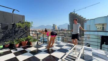 Engaging in an Outdoor Yoga Practice on a Rooftop with a Beautiful Scenic View All Around video