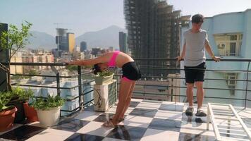 Engaging in Relaxation and Stretching Activities on a Beautiful Rooftop Balcony Setting video