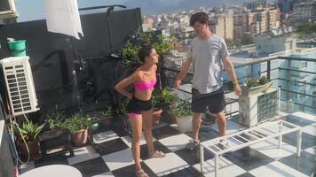 Participate in a Dynamic Rooftop Workout Session set against the beautiful Cityscape video