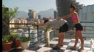 Engaging in a Morning Fitness Routine on the Rooftop with a Beautiful Scenic View to Enjoy video