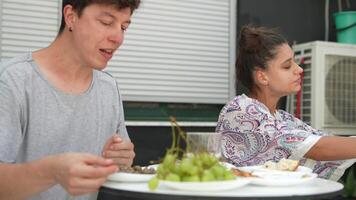A couple enjoying a delightful meal in a relaxed setting that exudes warmth and intimacy video