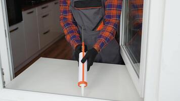 Windows installation worker use of foam when installing windows video