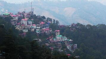 A hilly landscape full of residential complexes in Himachal Pradesh, India photo