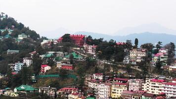 A hilly landscape full of residential complexes in Himachal Pradesh, India photo