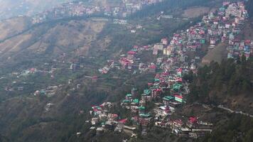 A hilly landscape full of residential complexes in Himachal Pradesh, India photo