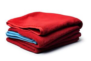 A stack of two red towels with a blue towel folded in between on a white background. photo
