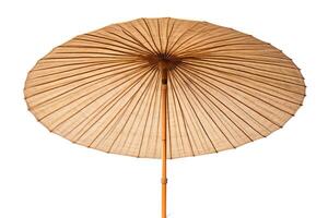 A beautiful handmade paper umbrella with a bamboo handle. The umbrella is a warm brown color and has a intricate design. photo