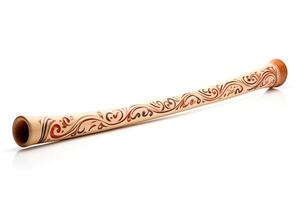The didgeridoo is a wind instrument that is played by blowing into a long, hollow tube photo