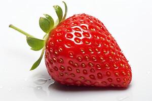 A close-up image of a single, ripe strawberry on a white surface. The strawberry is red, juicy, and has a green stem. photo