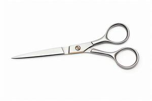 Silver scissors with sharp blades, closed position, isolated on a white background, format for craft and office supplies. photo