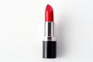 A single tube of red lipstick sits on a white background. The lipstick is unworn and the cap is on. photo