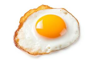 Image of a fried egg with a runny yolk on a white background. photo