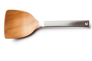 A wooden spatula with a silver handle isolated on a white background. photo