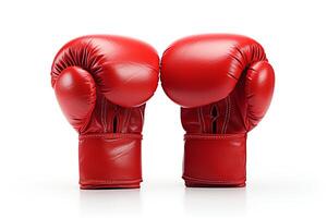 A pair of red boxing gloves on a white background. The gloves are made of leather and have a lace-up closure. The gloves are well-worn and show signs of use. photo