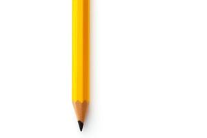 Bright yellow pencil, perfectly sharpened, standing upright, isolated on a white background, available in highresolution . photo