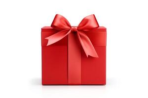 A large red gift box with a red ribbon wrapped around a separate lid with a bow on top. The box is sitting on a white surface with a white background. photo