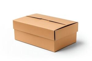 A brown cardboard box with a white background. The box is closed and has a flap on top. The box is sitting on a white surface. photo