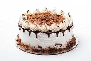 A beautiful chocolate cake with white frosting and chocolate shavings on top. The cake is sitting on a white plate. The background is white. photo