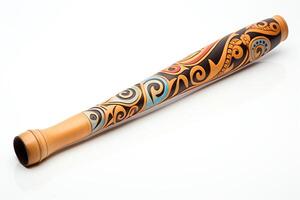 A didgeridoo is a wind instrument that is played by blowing into a mouthpiece photo