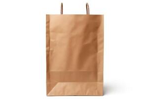 A brown paper bag is sitting on a white background. The bag is empty and has a handle. photo